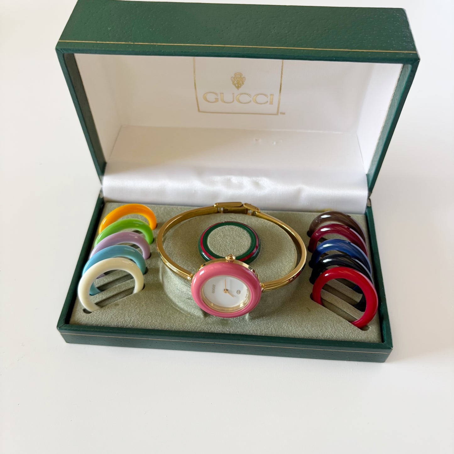 Gucci 1990s Interchangeable Bezel Gold Plated Bangle Watch with 12 bezels, case