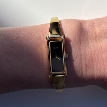 Gucci 1990s Black Dial Rectangular Gold Plated Bangle Watch