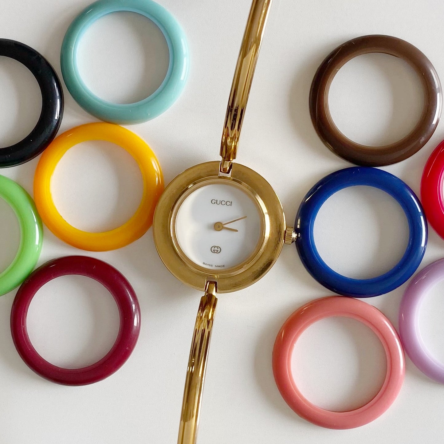 Gucci 1990s Interchangeable Bezel Gold Plated Bangle Watch with 12 bezels, case