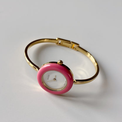 Gucci 1990s Interchangeable Bezel Gold Plated Bangle Watch with case, 12 bezels