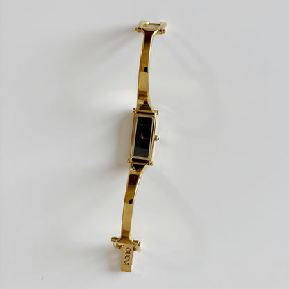 Gucci 1990s Black Dial Rectangular Gold Plated Bangle Watch