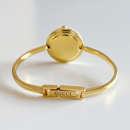 Gucci 1990s Interchangeable Bezel Gold Plated Bangle Watch with 12 bezels, case