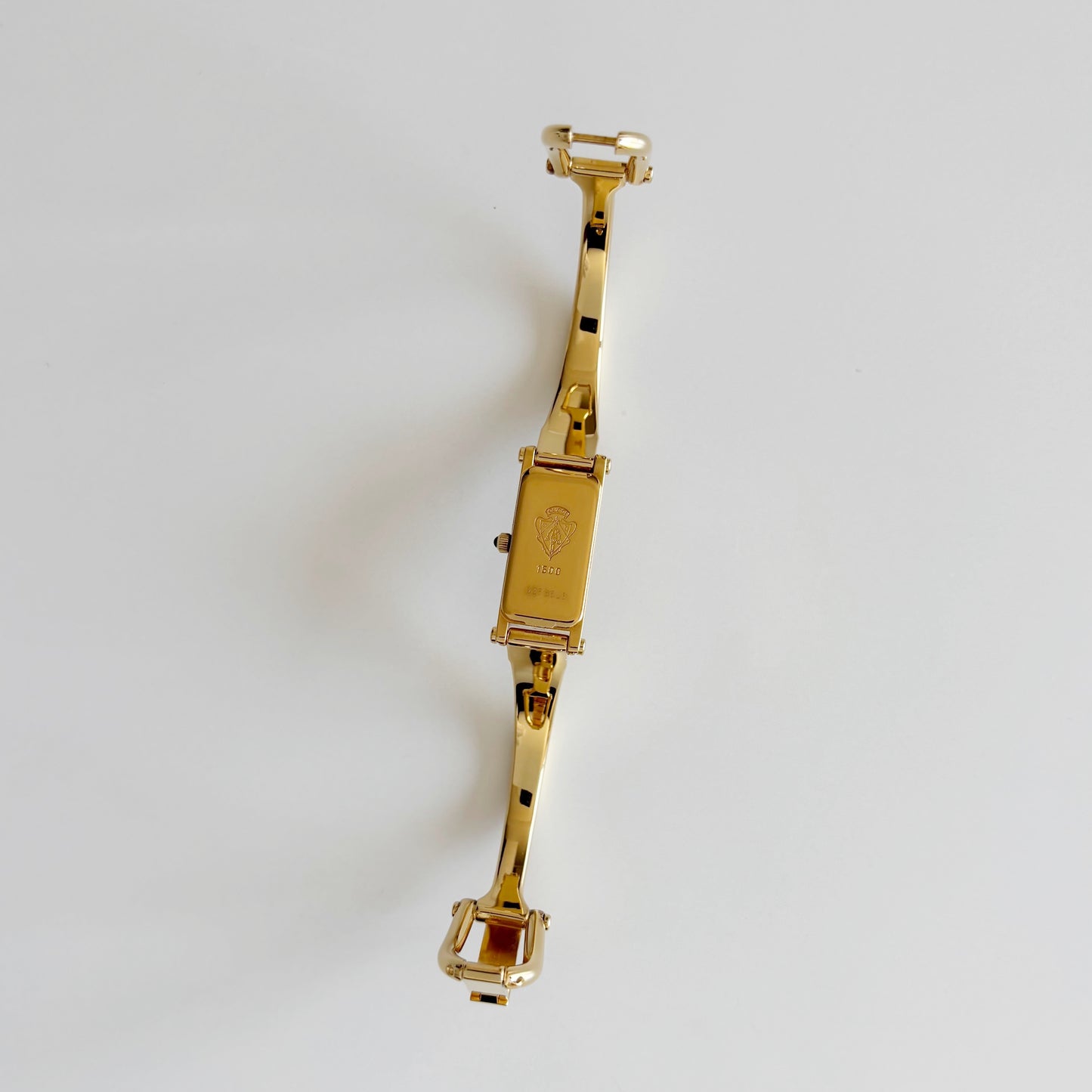 Gucci 1990s Rectangular Gold Dial Gold Plated Bangle Watch