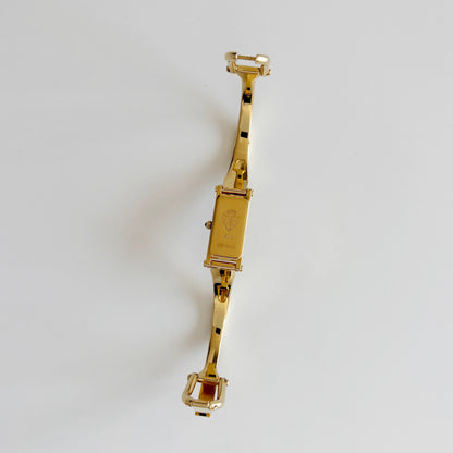Gucci 1990s Rectangular Gold Dial Gold Plated Bangle Watch