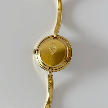 Gucci 1990s Interchangeable Bezel Gold Plated Bangle Watch with 12 bezels, case