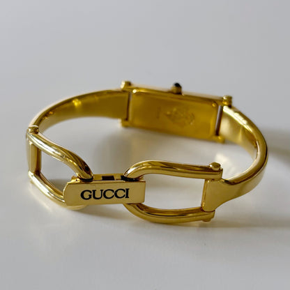 Gucci 1990s Rectangular Gold Dial Gold Plated Bangle Watch (Small)