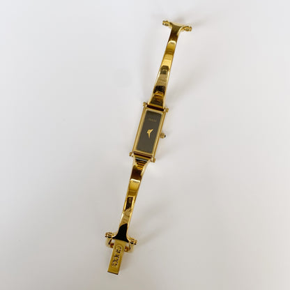 Gucci 1990s Rectangular Black Dial Gold Plated Bangle Watch