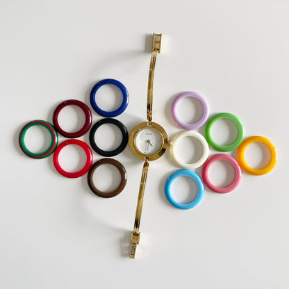 Gucci 1990s Interchangeable Bezel Gold Plated Bangle Watch with 12 bezels, case