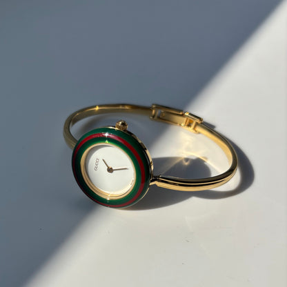 Gucci 1990s Interchangeable Bezel Gold Plated Bangle Watch with 12 bezels, case