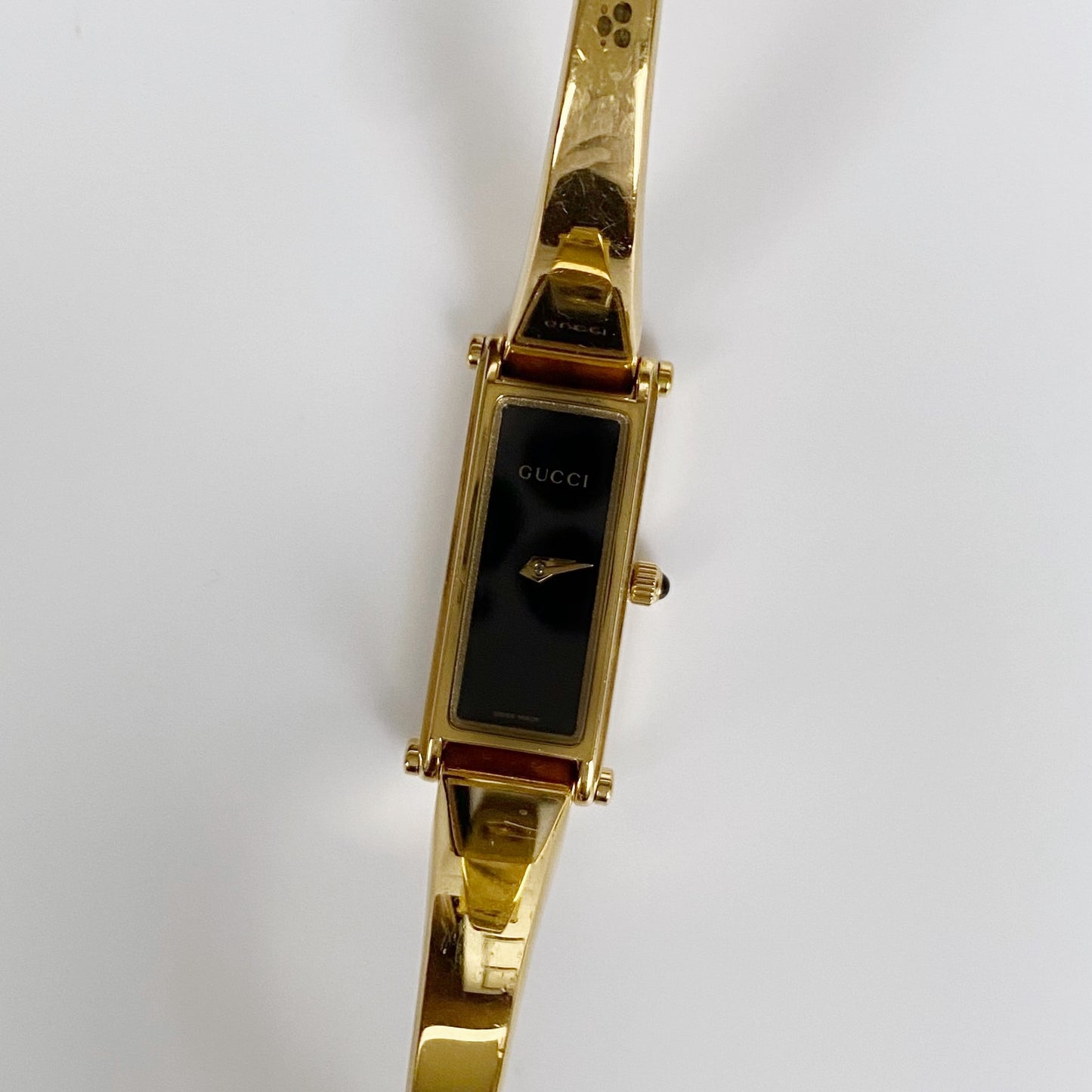 Gucci 1990s Black Dial Rectangular Gold Plated Bangle Watch