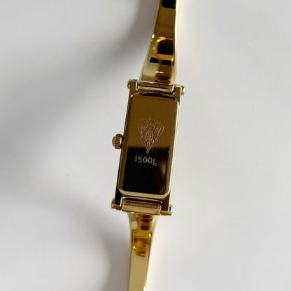Gucci 1990s Gold Rectangular Dial Gold Plated Bangle Watch