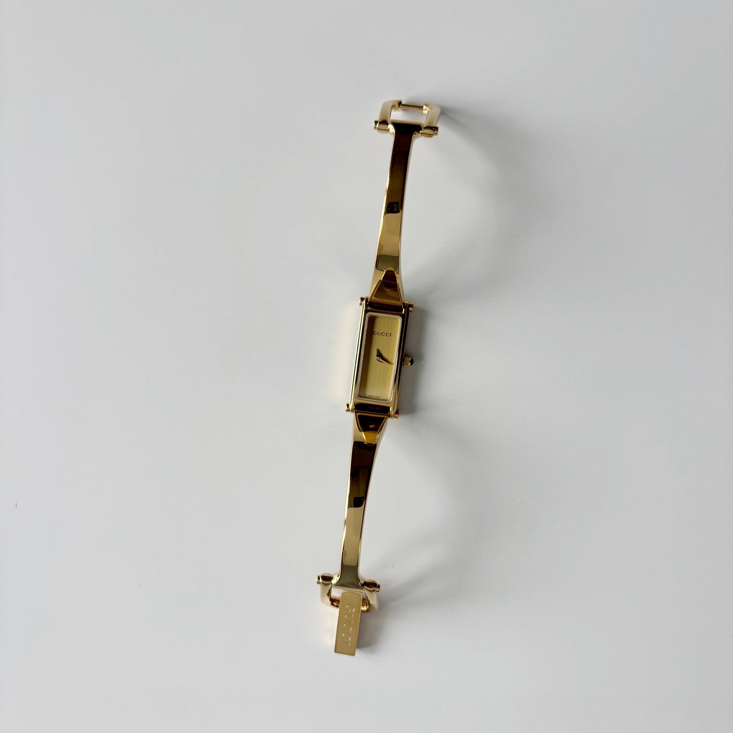 Gucci 1990s Gold Rectangular Dial Gold Plated Bangle Watch
