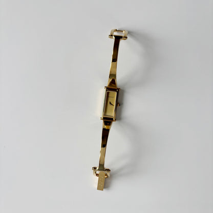 Gucci 1990s Gold Rectangular Dial Gold Plated Bangle Watch