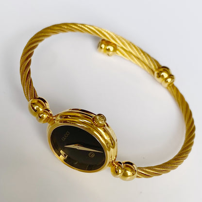 Gucci 1990s Black Dial Gold Plated Bangle Watch