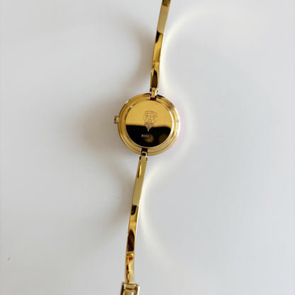 Gucci 1990s Interchangeable Bezel Gold Plated Bangle Watch with 12 bezels, case