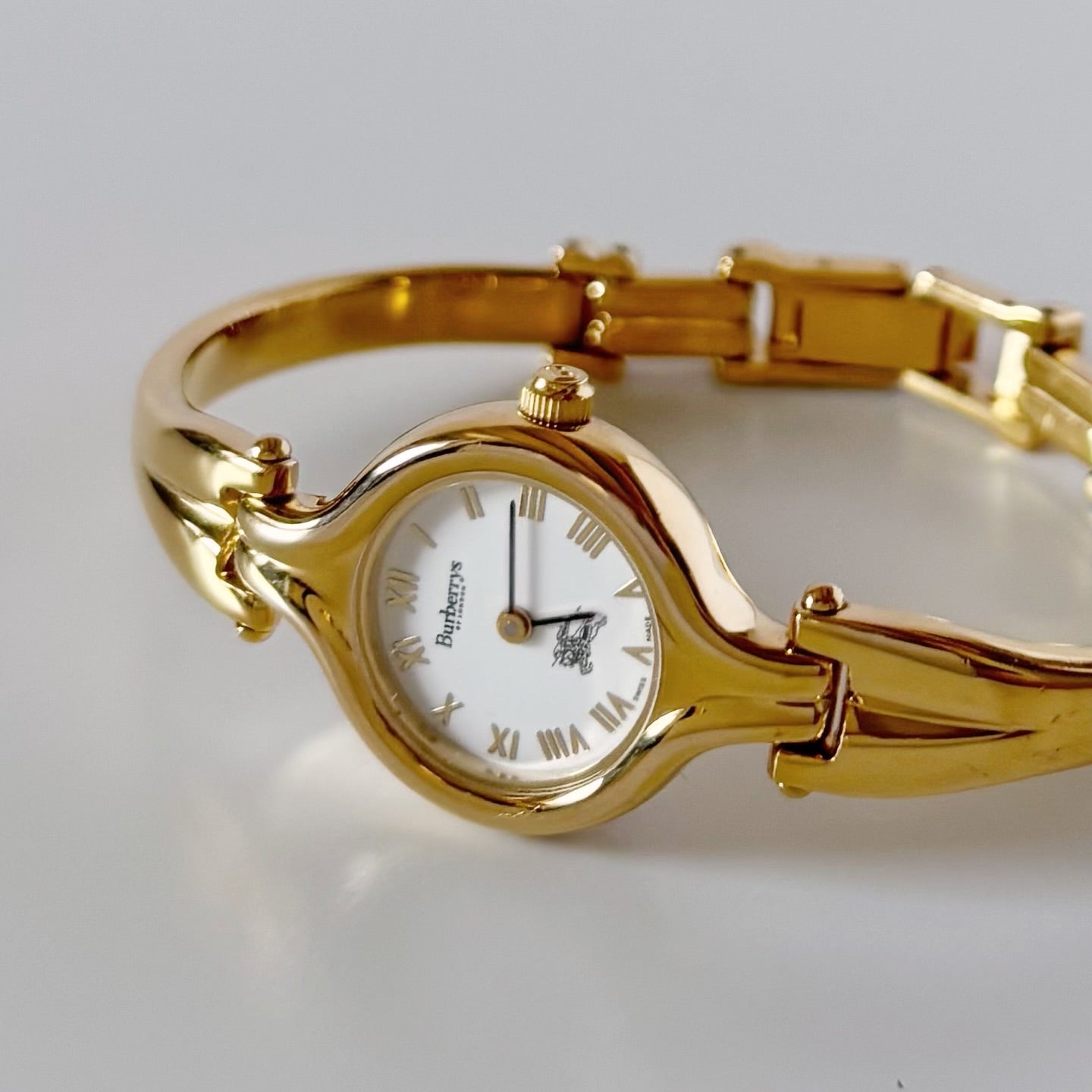 Burberry 1990s Round Dial Gold Plated Bangle Watch