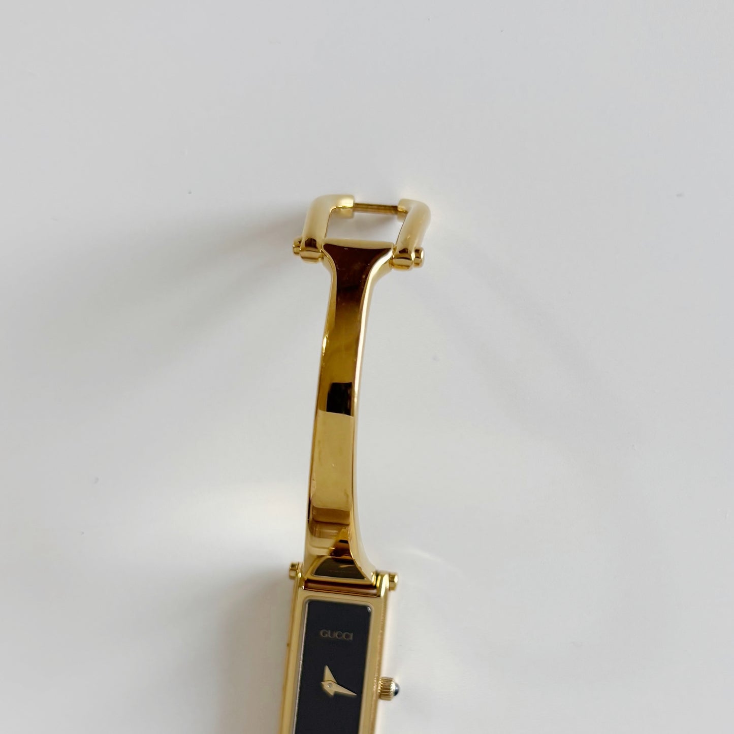 Gucci 1990s Black Dial Rectangular Gold Plated Bangle Watch