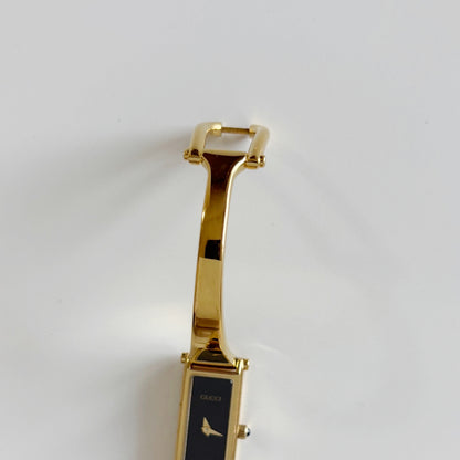 Gucci 1990s Black Dial Rectangular Gold Plated Bangle Watch