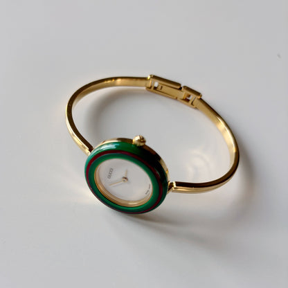 Gucci 1990s Interchangeable Bezel Gold Plated Bangle Watch with 12 bezels, case