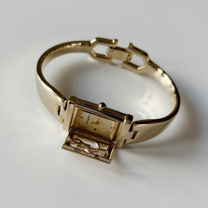 Yves Saint Laurent 1990s Peek-A-Boo Gold Plated Bangle Watch