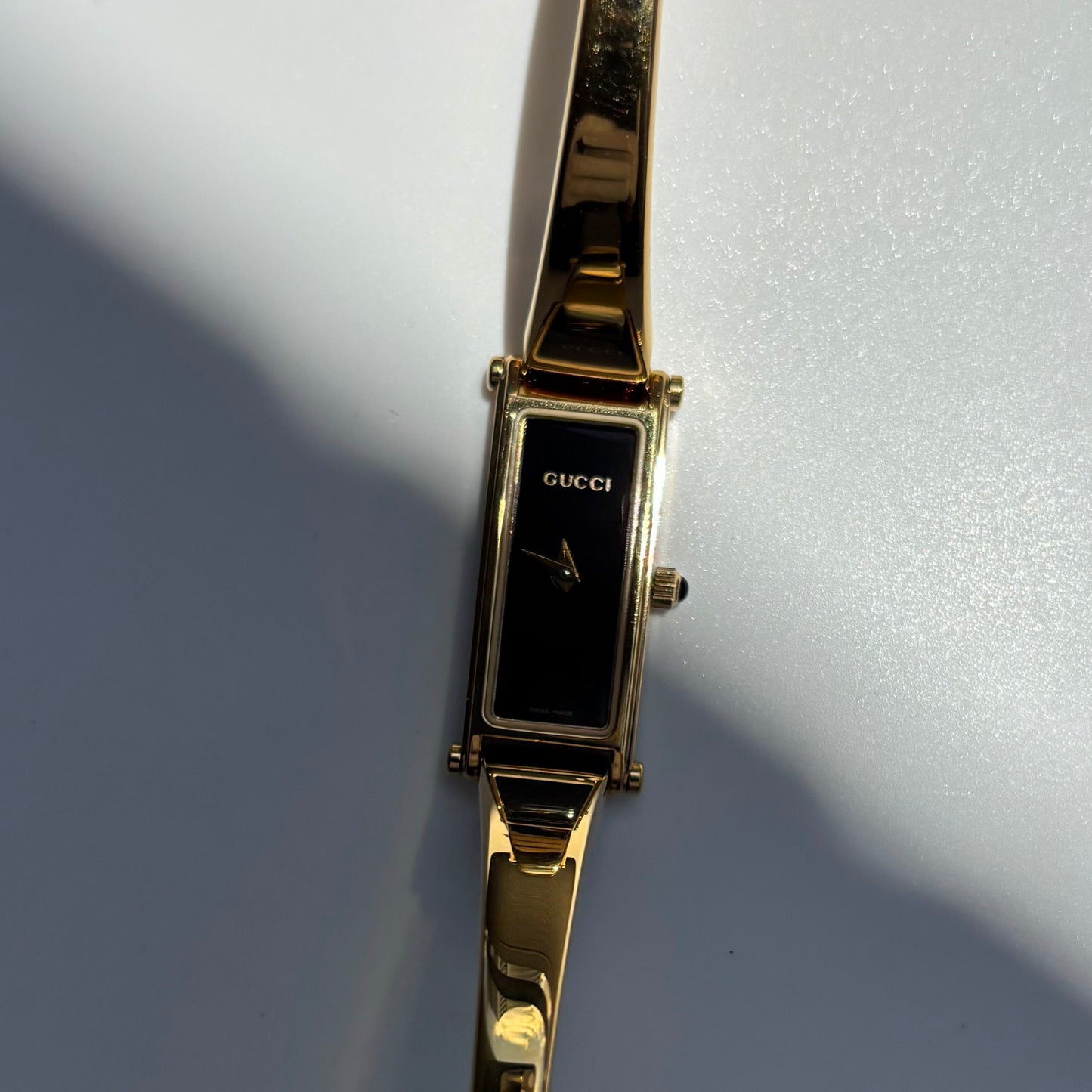 Gucci 1990s Black Rectangular Dial Gold Plated Bangle Watch