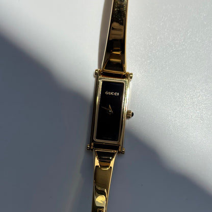 Gucci 1990s Black Rectangular Dial Gold Plated Bangle Watch