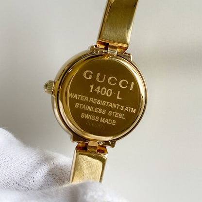 Gucci 1990s Round Dial Gold Plated Bangle Watch