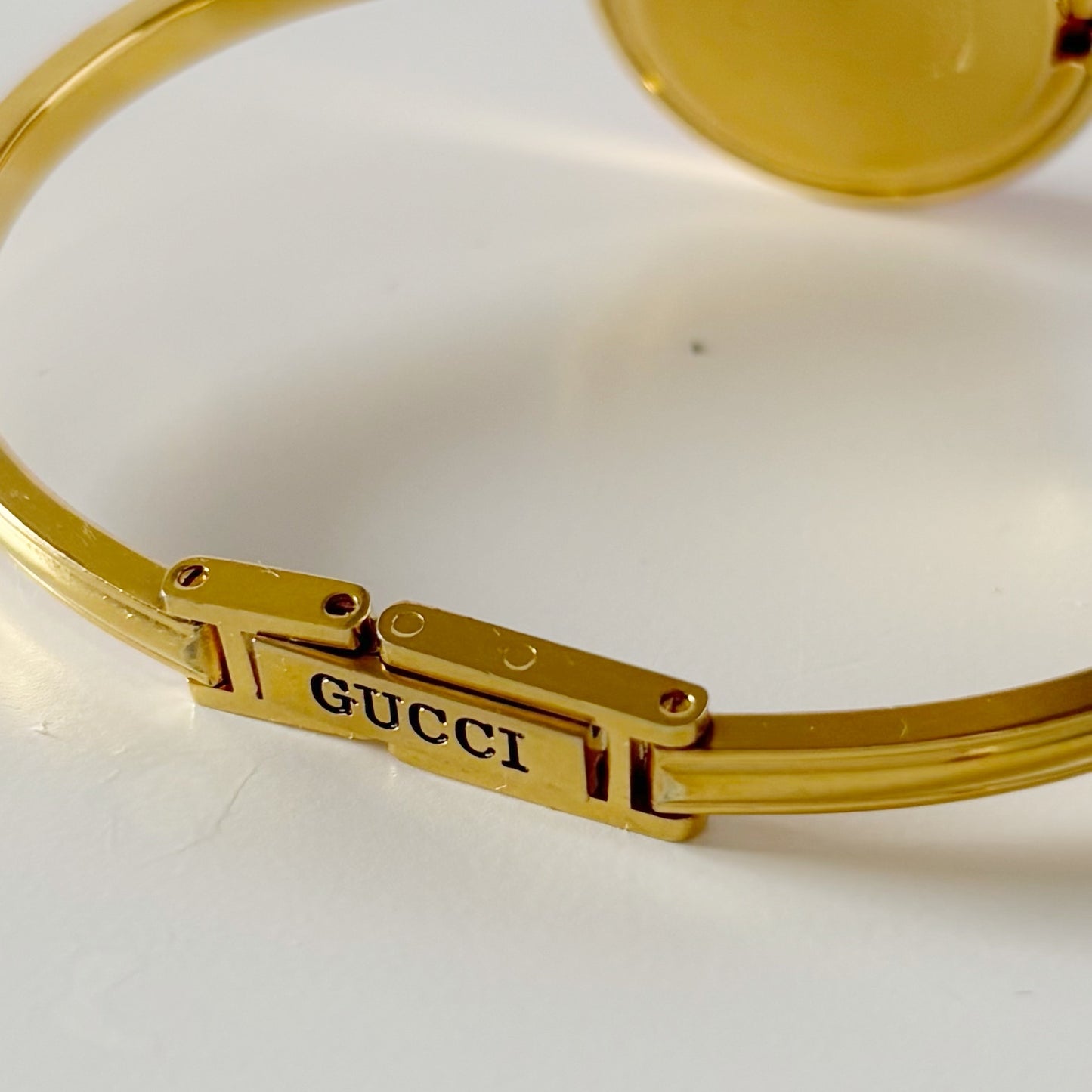 Gucci 1990s Interchangeable Bezel Gold Plated Bangle Watch with 12 bezels, case
