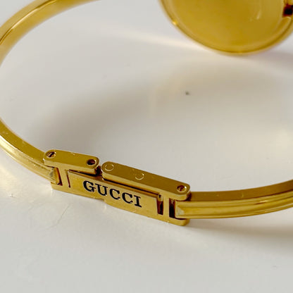 Gucci 1990s Interchangeable Bezel Gold Plated Bangle Watch with 12 bezels, case