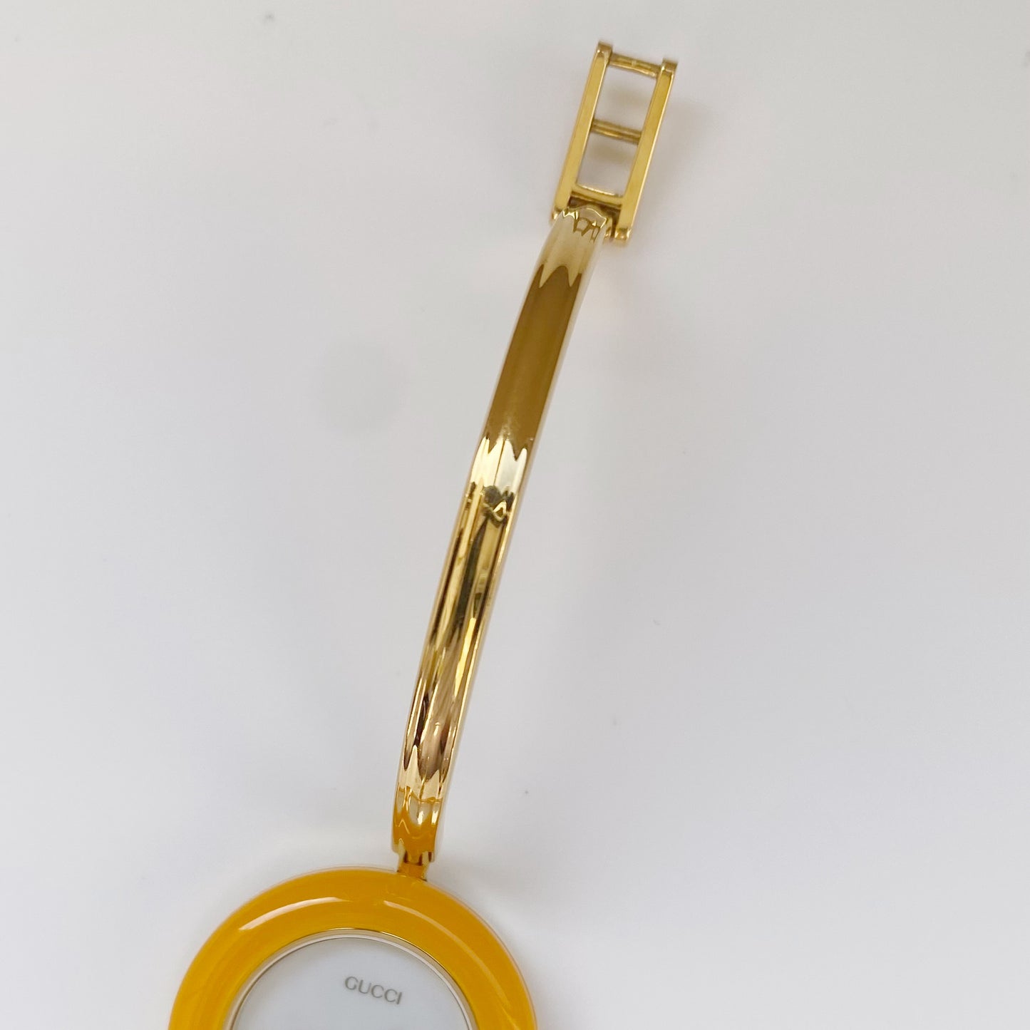 Gucci 1990s Interchangeable Bezel Gold Plated Bangle Watch with 12 bezels, case