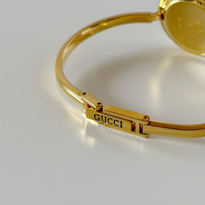 Gucci 1990s Interchangeable Bezel Gold Plated Bangle Watch with 12 bezels, case