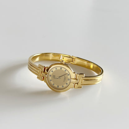 Givenchy 1990s Round Dial Gold Plated Bangle Watch
