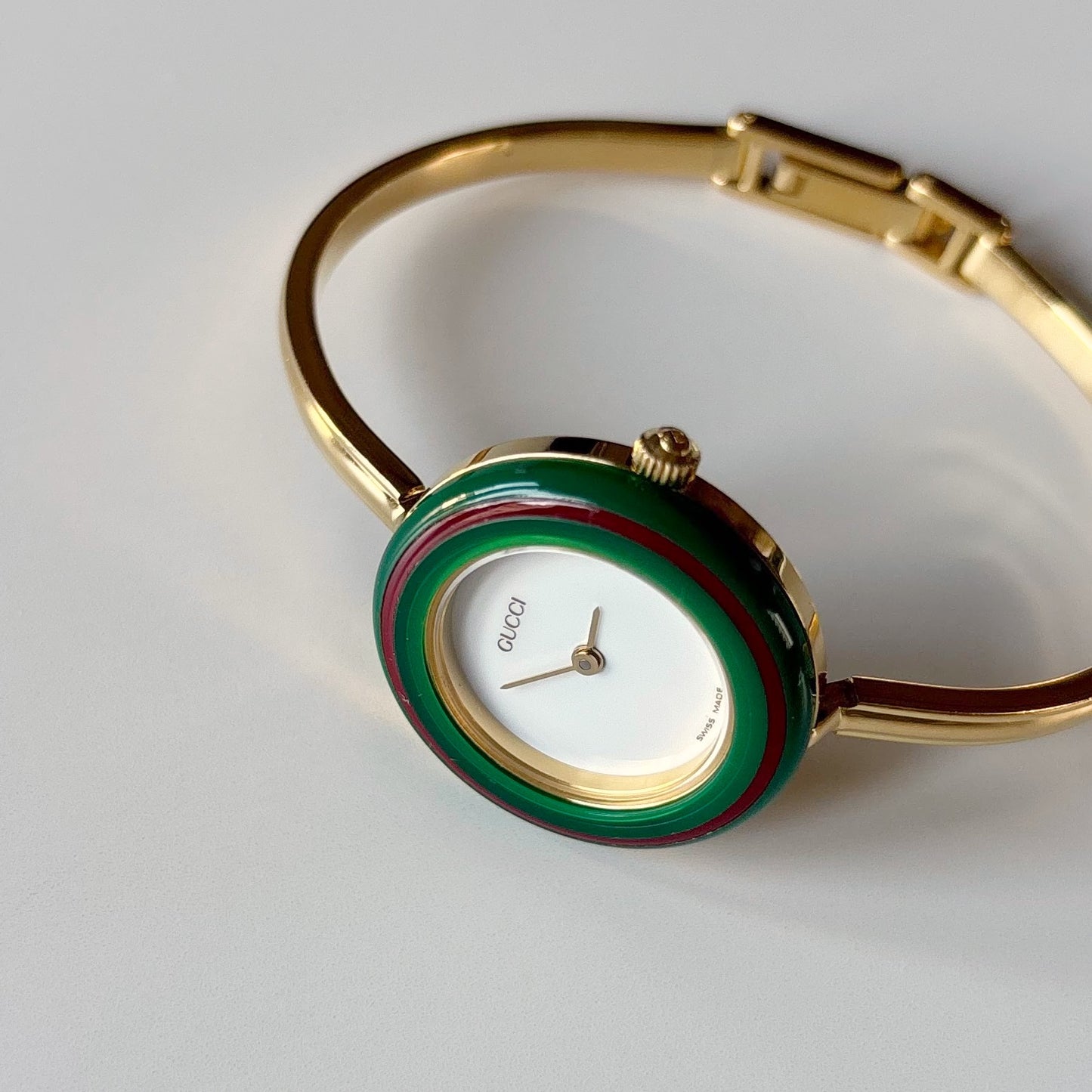 Gucci 1990s Interchangeable Bezel Gold Plated Bangle Watch with 12 bezels, case