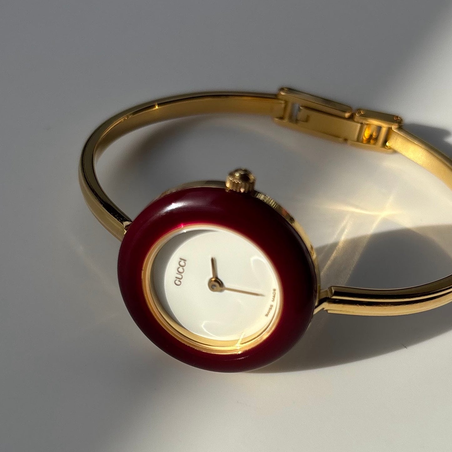 Gucci 1990s Interchangeable Bezel Gold Plated Bangle Watch with 12 bezels, case