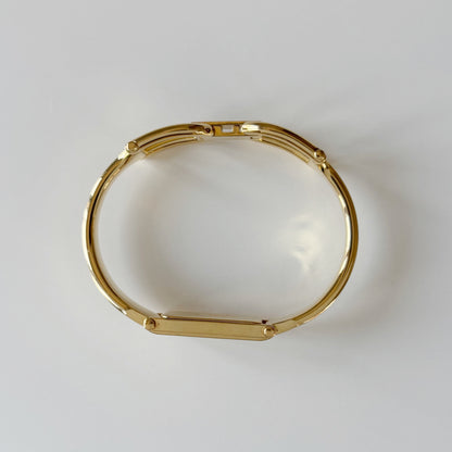 Gucci 1990s Rectangular Gold Dial Gold Plated Bangle Watch