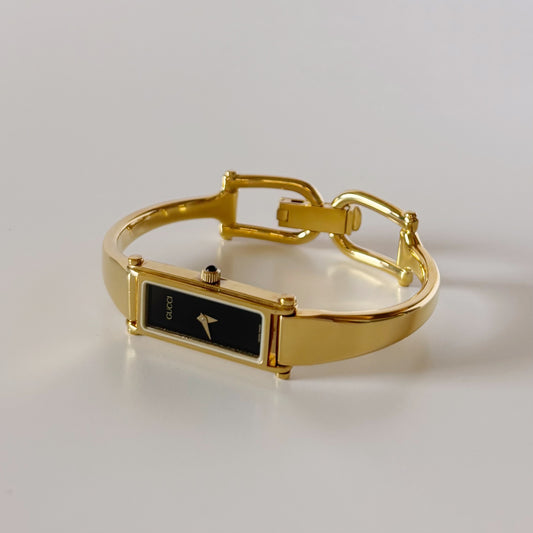Gucci 1990s Black Rectangular Dial Gold Plated Bangle Watch