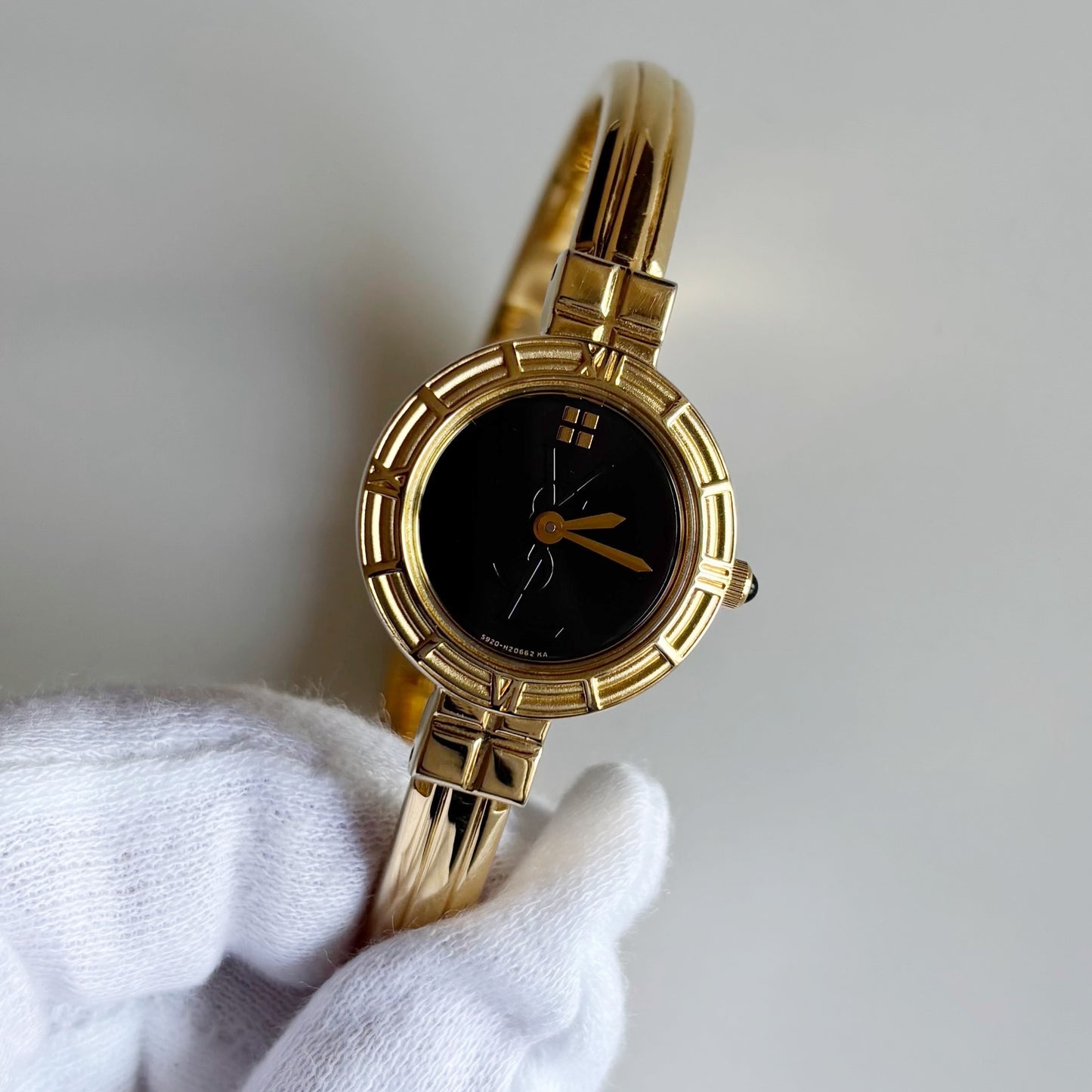 Yves Saint Laurent 1990s Black Round Dial Gold Plated Bangle Watch