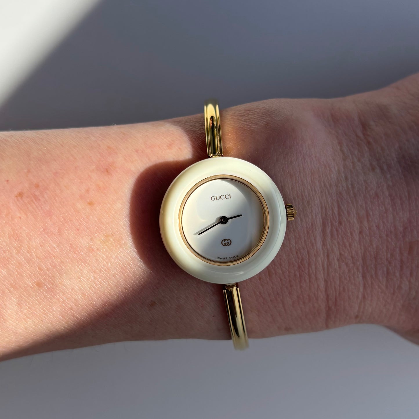Gucci 1980s Interchangeable Bezel Gold Plated Bangle Watch with 12 bezels, case