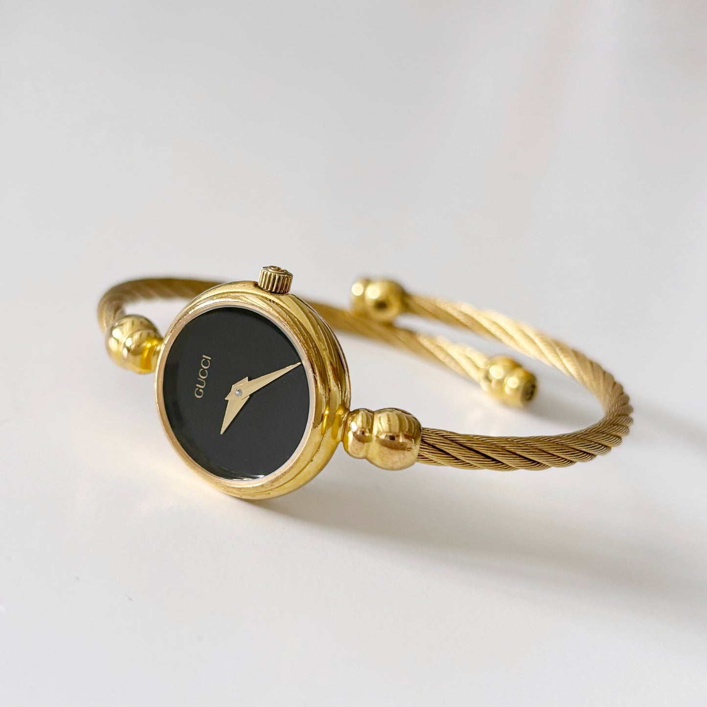 Gucci 1990s Black Dial Gold Plated Bangle Watch