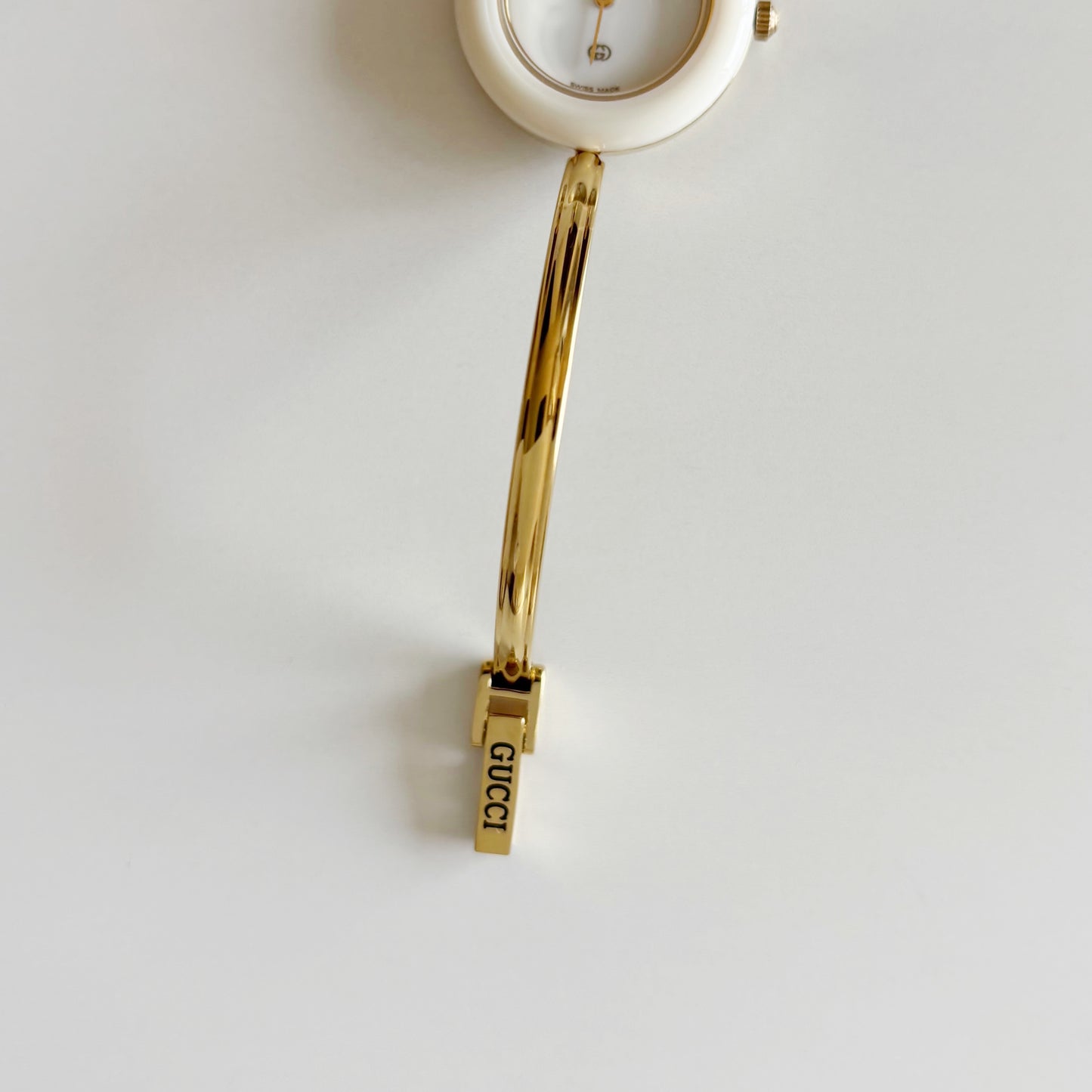 Gucci 1990s Interchangeable Bezel Gold Plated Bangle Watch with 12 bezels, case