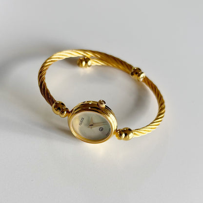 Gucci 1990s Seashell Dial Gold Plated Cable Band Bangle Watch