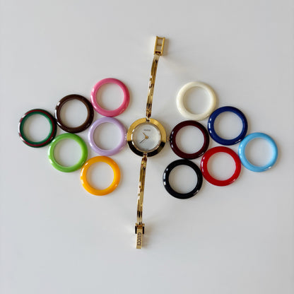 Gucci 1990s Interchangeable Bezel Gold Plated Bangle Watch with 12 bezels, case (Small)