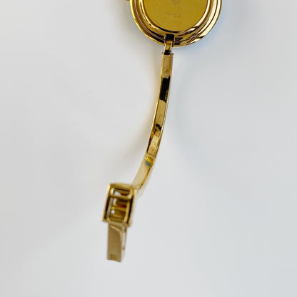 Gucci 1990s Interchangeable Bezel Gold Plated Bangle Watch with 12 bezels, case