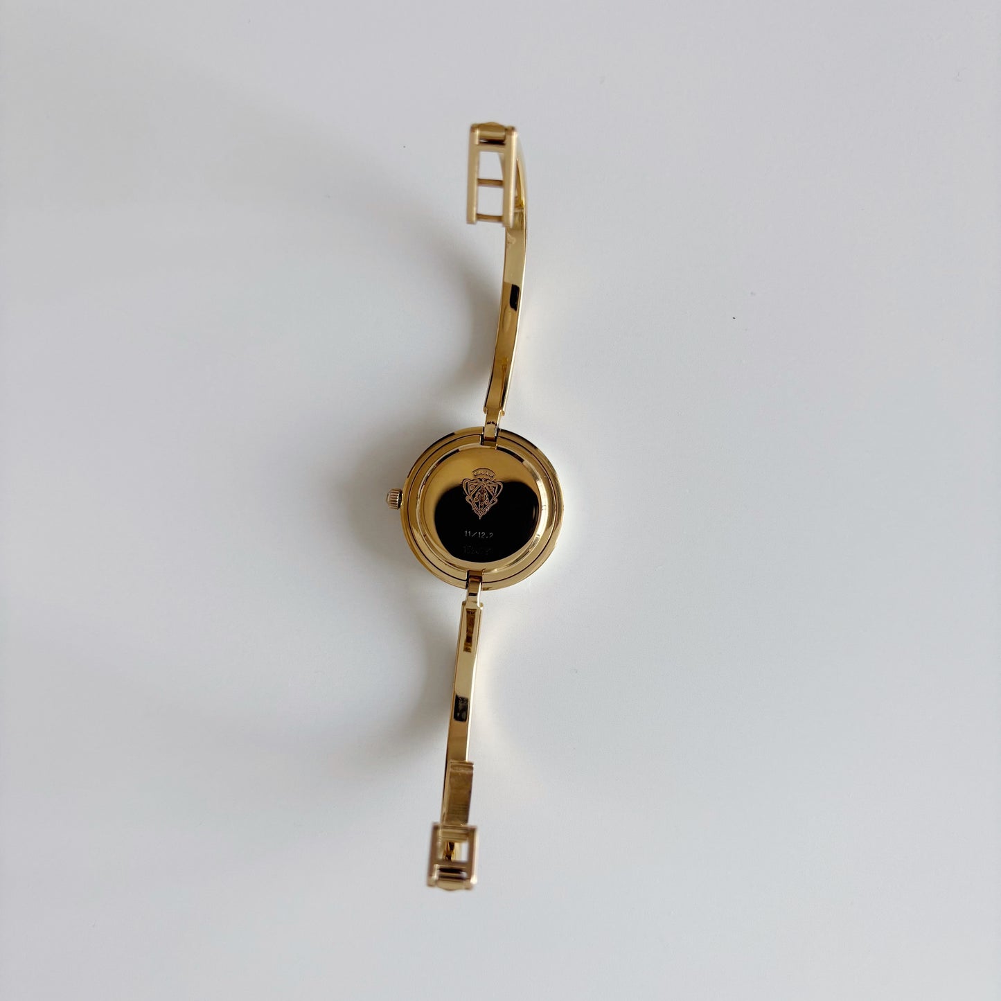 Gucci 1990s Interchangeable Bezel Gold Plated Bangle Watch with 12 bezels, case