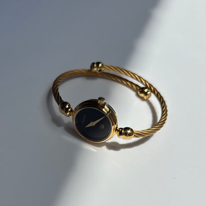 Gucci 1990s Black Round Dial Cable Gold Plated Bangle Watch