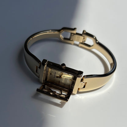 Yves Saint Laurent 1990s Peek-A-Boo Gold Plated Bangle Watch