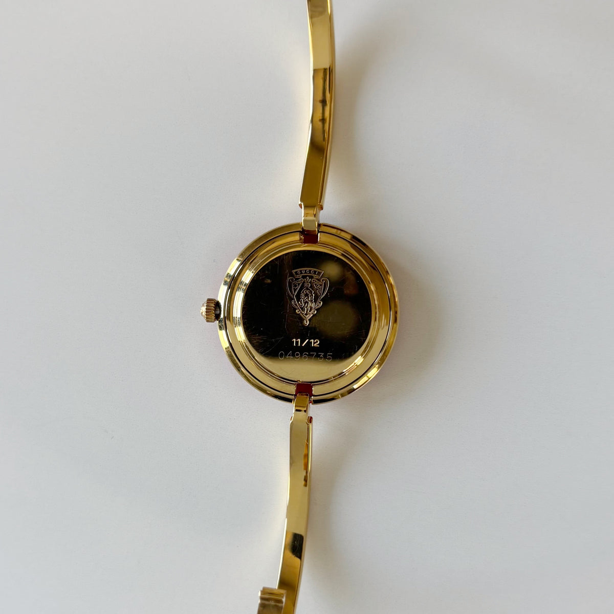 Gucci 1990s Interchangeable Bezel Gold Plated Bangle Watch with 12 bezels, case