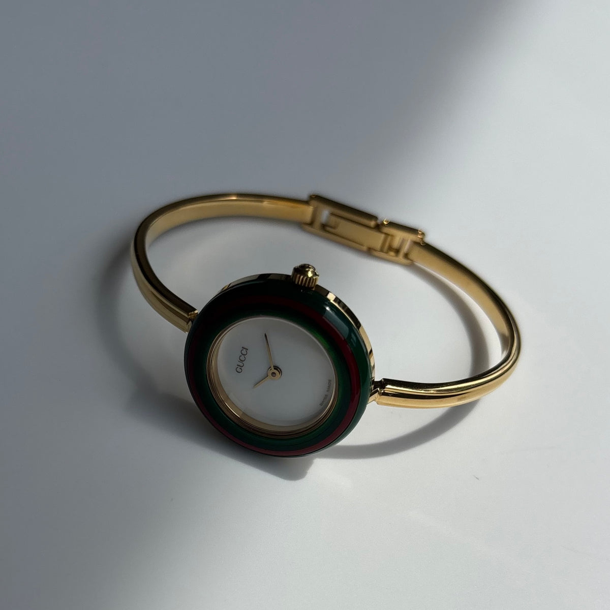Gucci 1990s Interchangeable Bezel Gold Plated Bangle Watch with 12 bezels, case