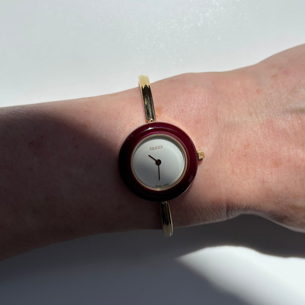 Gucci 1990s Interchangeable Bezel Gold Plated Bangle Watch with 12 bezels, case