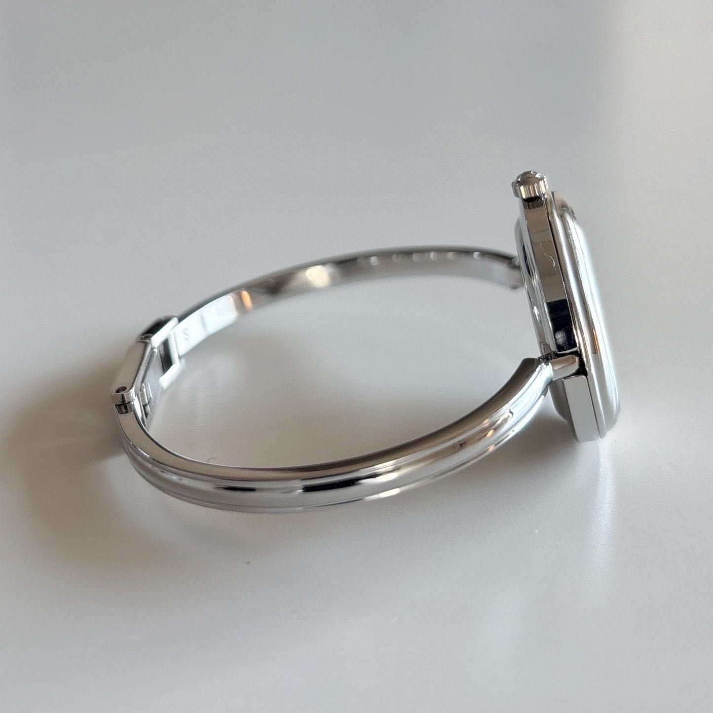 Gucci 1990s Interchangeable Bezel Stainless steel Bangle Watch with 12 bezels, case (Small)